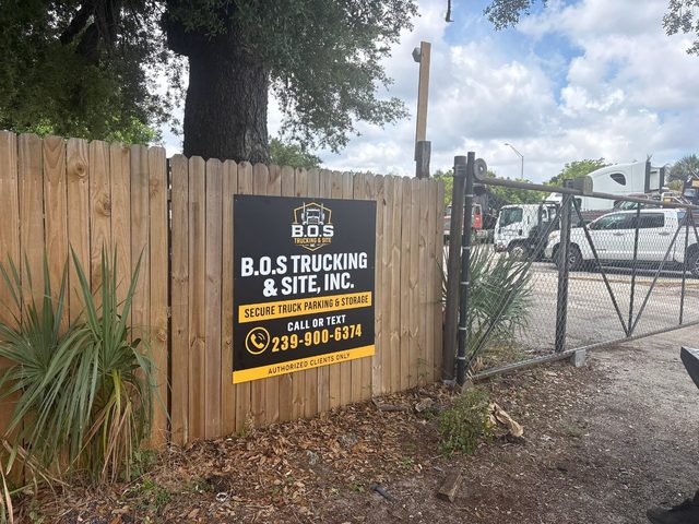 B.O.S. Trucking & Site signage on the yard fence, Market Street, Fort Myers